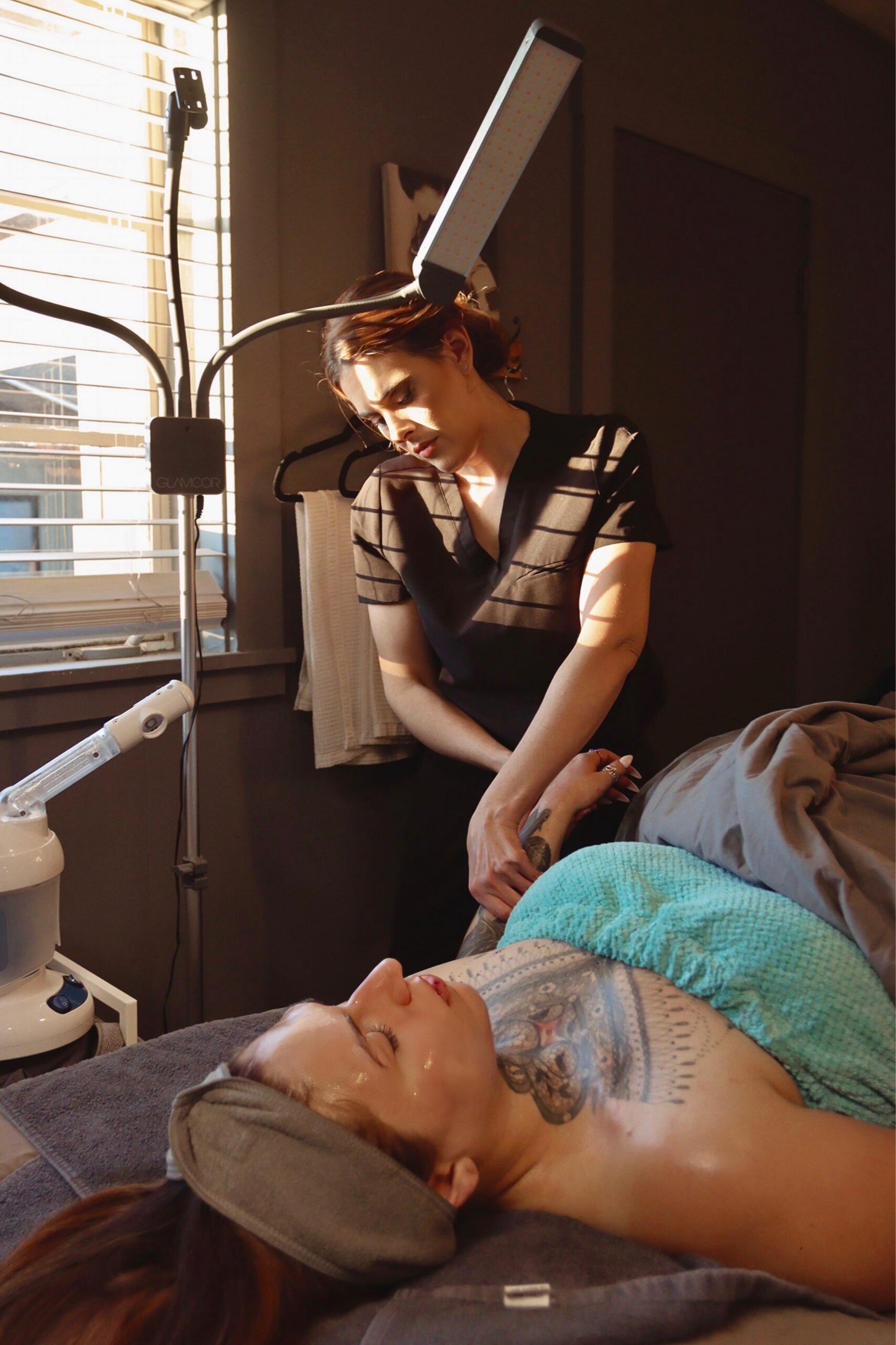 ashley from ethereal esthetics flagstaff provides hand massages during facial